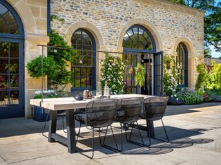 Barker and Stonehouse table with festoon lights on patio