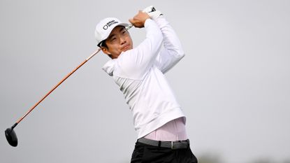 Michael Kim of the United States hits his shot from the 18th tee during the first round of the Farmers Insurance Open on the Torrey Pines North Course