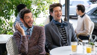 Brian with his husband Charlie sitting at a table and laughing in Shrinking.