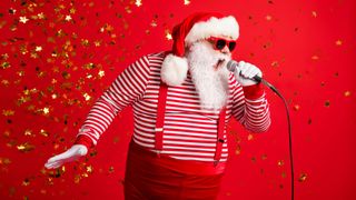 Santa singing into a microphone