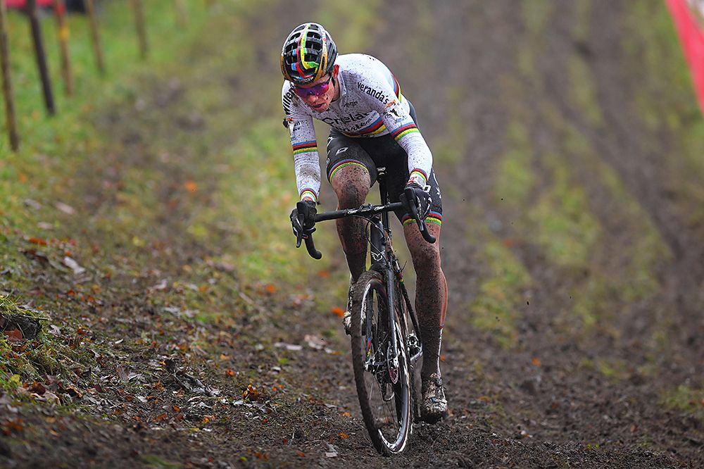 Wout Van Aert riders through the thick mud in Namur