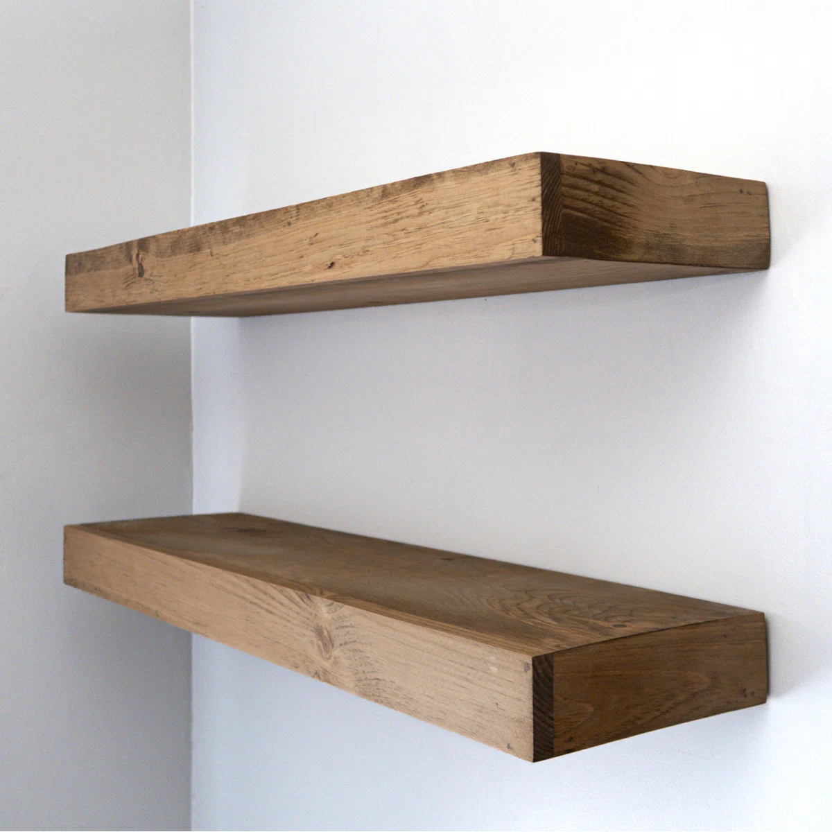 Two rustic wooden floating shelves
