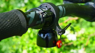 Granite Cricket Bell fitted to a black handlebar