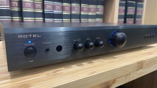 Rotel A8 integrated amplifier slight angle showing front panel and Rotel logo