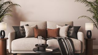 A zen living room with a sofa full of different throws and cushions