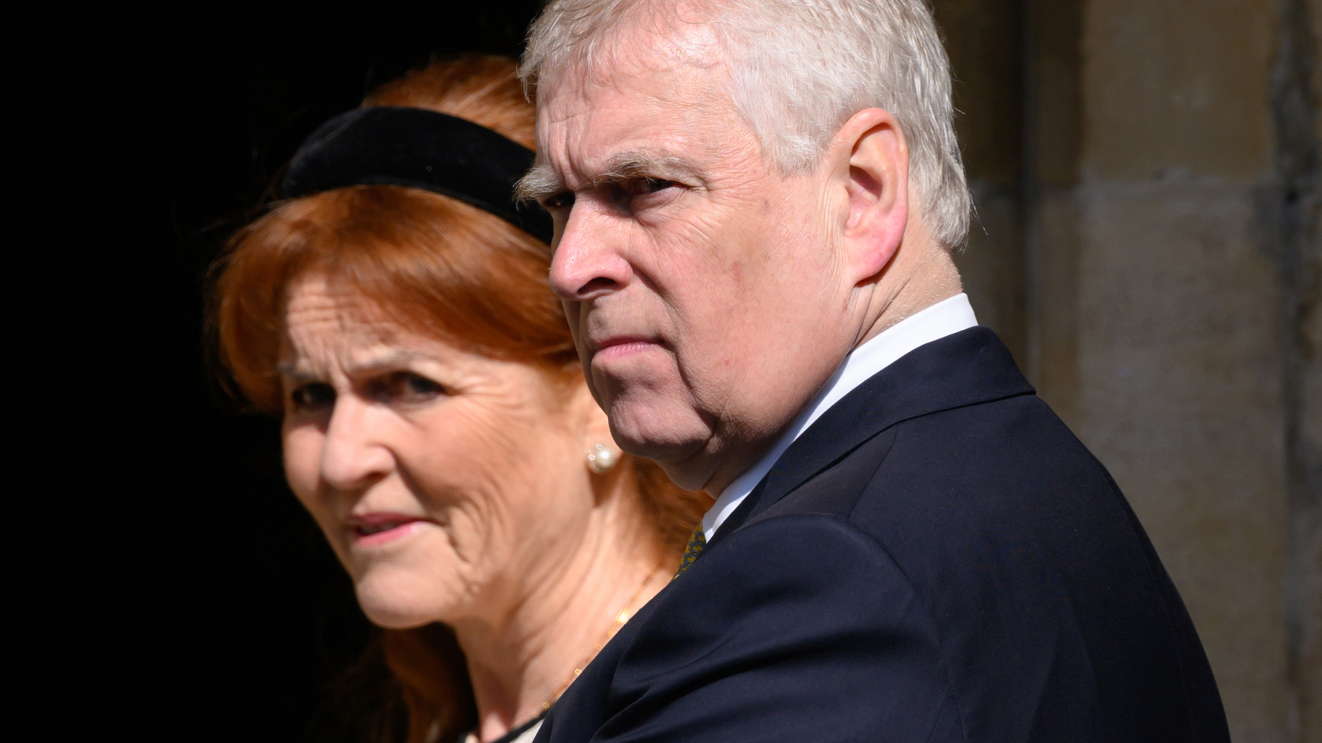 Sarah Ferguson has red hair and stands next to ex-husband Prince Andrew