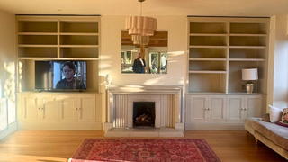 built in storage units in georgia and josh's living room alcove on either side of the fireplace