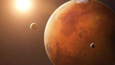 An artist's impression of Mars' moons Phobos (left) and Deimos (right) orbiting the Red Planet.