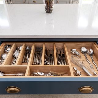 Open kitchen drawer with wooden organiser