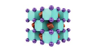 Crystal structure of Na₂He, which resembles a 3D checkerboard. The purple spheres represent sodium atoms, which are inside the green cubes that represent helium atoms. The red regions inside voids of the structure show areas where localized electron pairs reside.