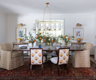 dining room with patterned chairs and flowers on table