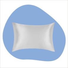 A white silk pillowcase on a blue background