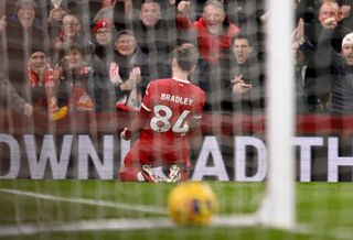 Conor Bradley of Liverpool celebrates after scoring the second goal during the Premier League match between Liverpool FC and Chelsea FC at Anfield on January 31, 2024 in Liverpool, England.