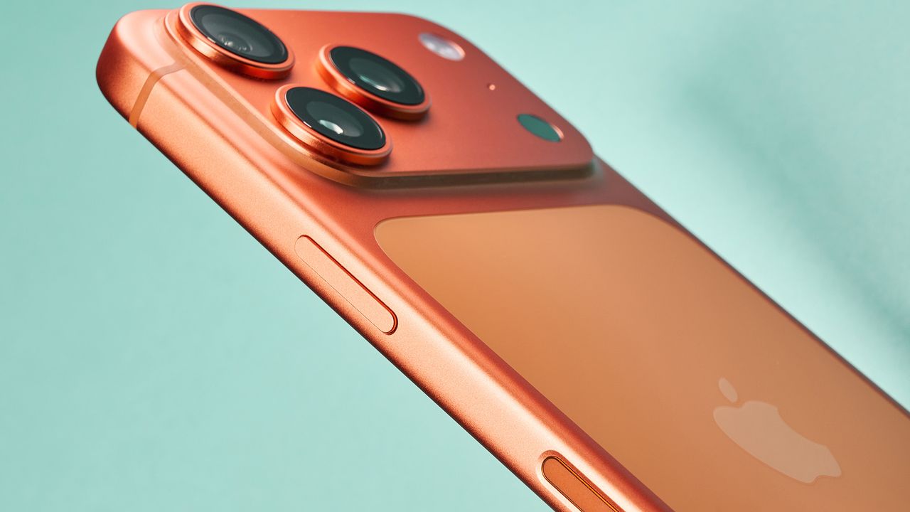 Apple iPhone 17 Pro in cosmic orange on green background
