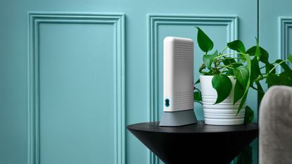 EE Smart Hub 7 Plus on a table in a living room – expanded using generative AI