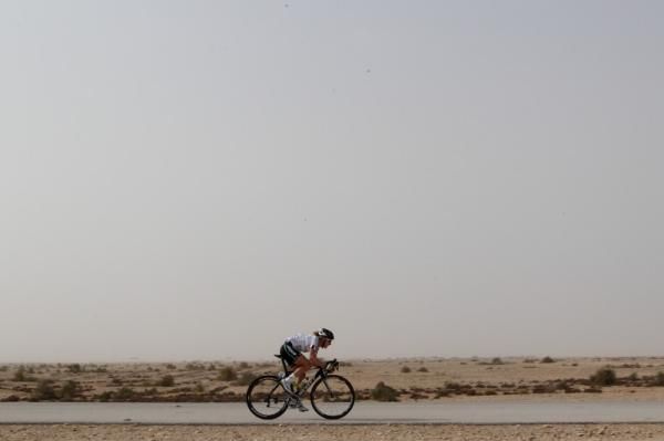 Judith Arndt (GreenEDGE-AIS) chases on her own, just behind the break, in the desert.