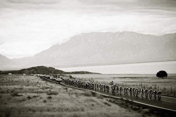 The bunch cruises along a lake on the way to Nebo.
