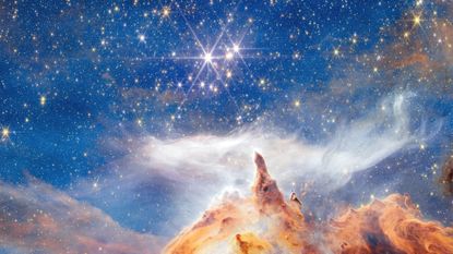 A JWST image of a star cluster with sparkling stars and cloudy rainbow colors