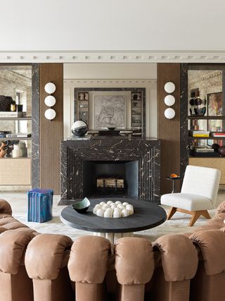 A living room with marble fireplace