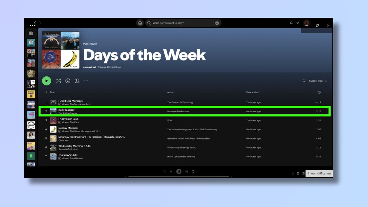 Screenshot showing how to reorder a playlist on Spotify - drop in place