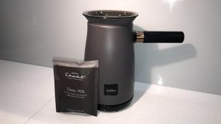 The Hotel Chocolat Velvetiser in charcoal with a sachet of hot chocolate