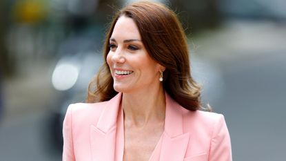 Catherine, Princess of Wales wearing a pink suit on a royal visit