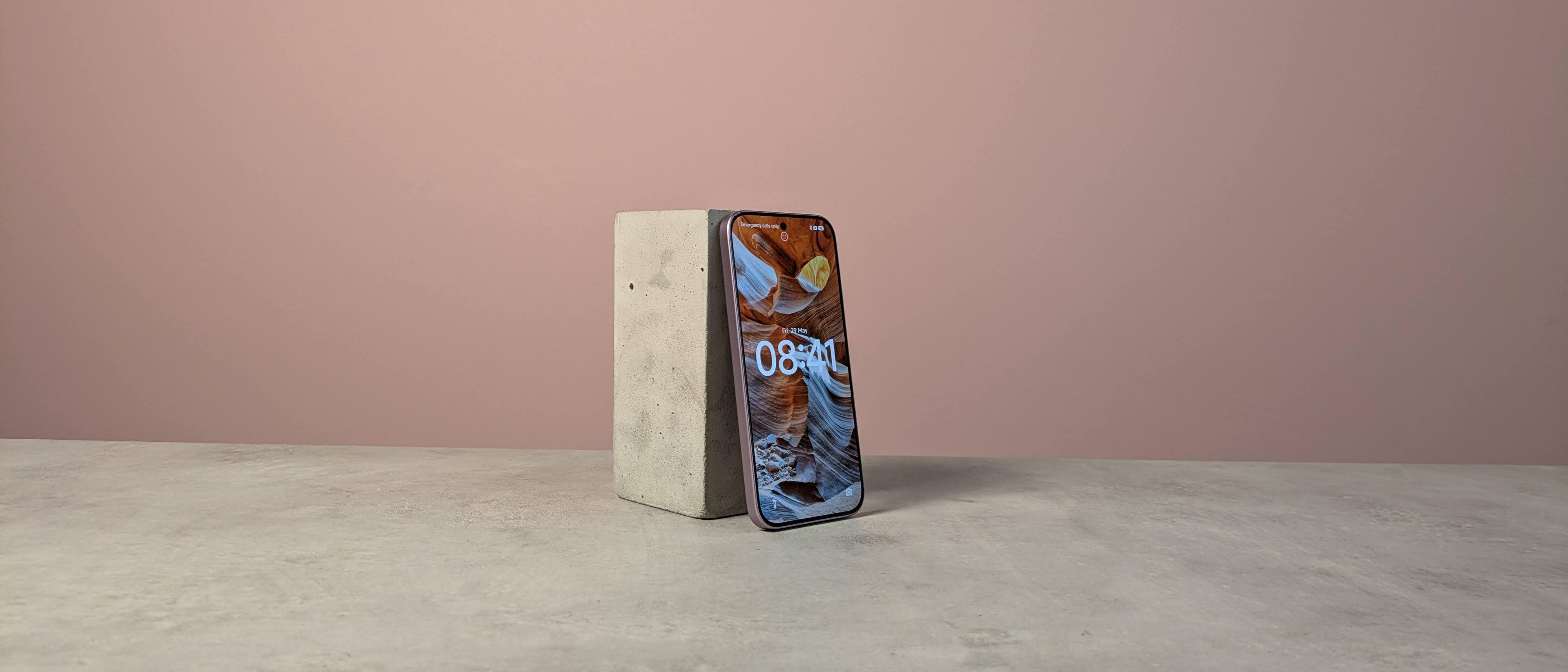 Three-quarter view of Xiaomi 17T on a desk with pink wall in background