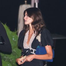 Kaia Gerber wearing a lace-trimmed black dress with white ballet pumps to dinner with Karlie Kloss at Nobu Malibu