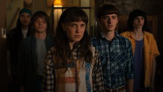 Eleven, Mike, Will, Argyle, and Jonathan stare at someone off screen in Stranger Things season 4 volume 1