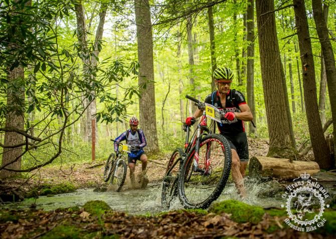 Steve Mee runs across the streamcrossing at the end of the second stage of the enduro