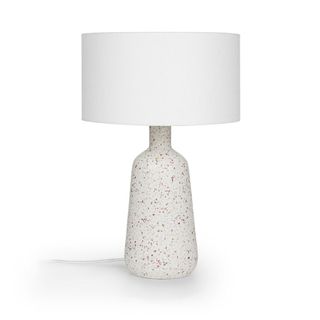 A white lamp with terrazzo base