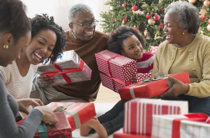 Family opening Christmas presents together