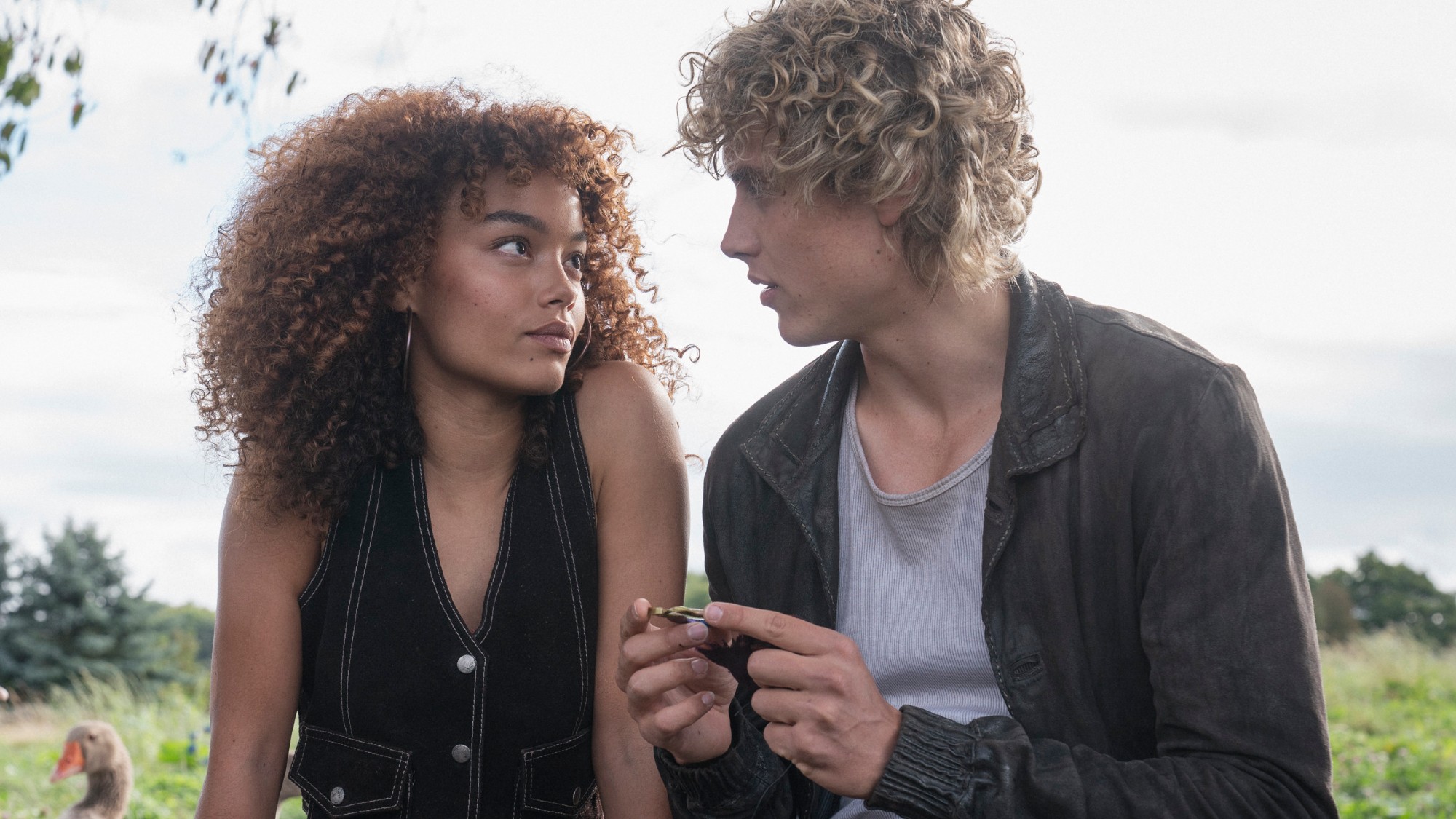 Whitney Peak and Joseph Zada looking into each other's eyes on The Hunger Games: Sunrise on the Reaping