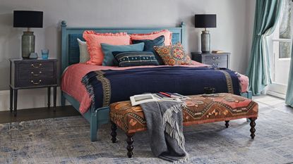 Bed pillow arrangements: Pink and blue styled boho bedroom with lots of decor and pillow arrangement 