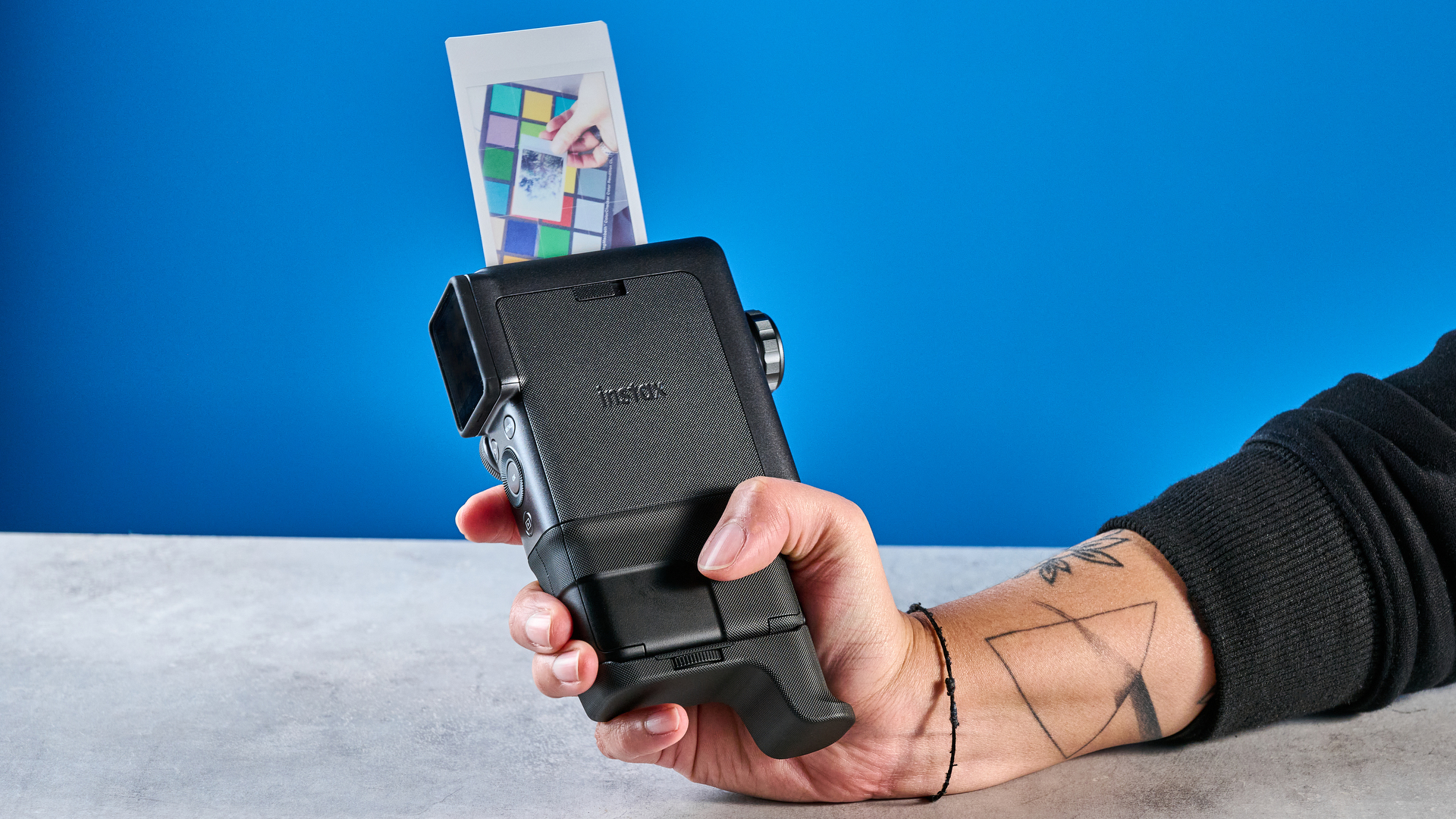 A Fujifilm Instax mini Evo Cinema hybrid instant camera