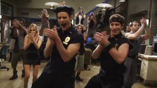 Bill Hader and Andy Samberg as cops clapping to the rhythm in an SNL Digital Short called "Stomp"