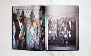 Open pages in the book showcasing colourful diamond shaped stained glass designs