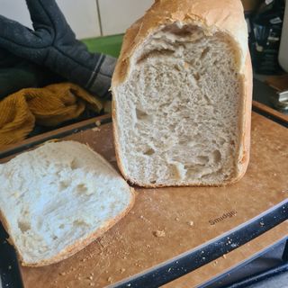 Baked bread on chopping board