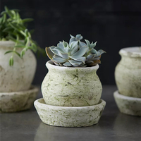 9. Earth Fired Clay White Curve Pots + Saucers for $68.00 at Anthropologie