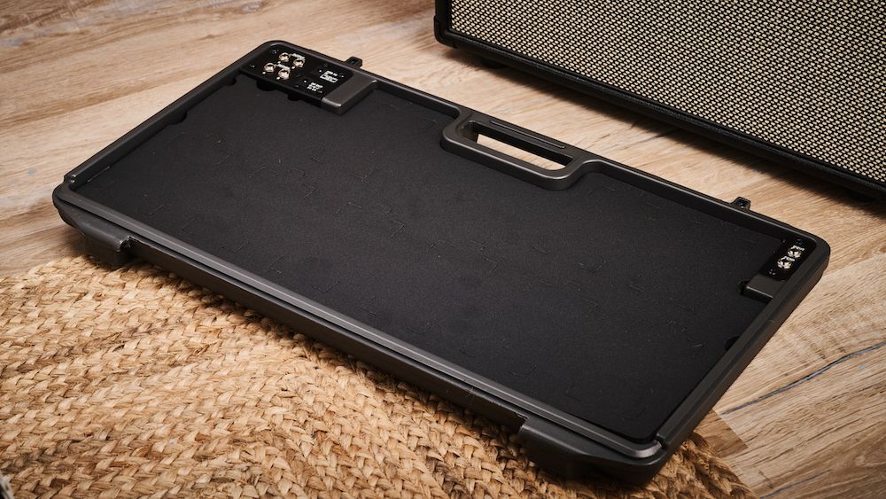 The pedal tray of the Boss BCB-90X pedalboard on a wooden floor