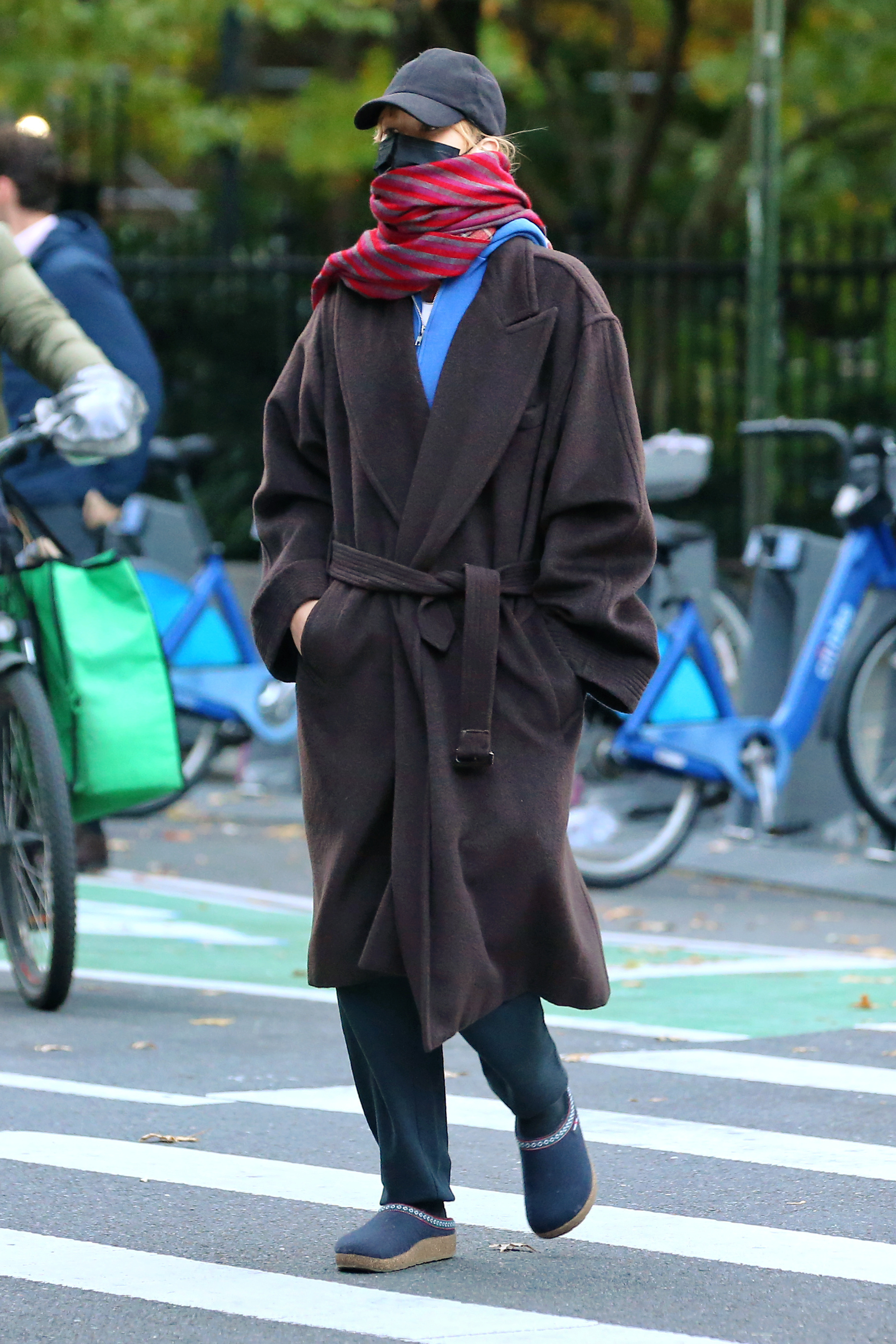 Jennifer Lawrence attempted to keep a low profile in a winter coat, a scarf, and her favorite Haflinger clogs