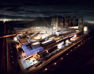 Large buildings lit up at night