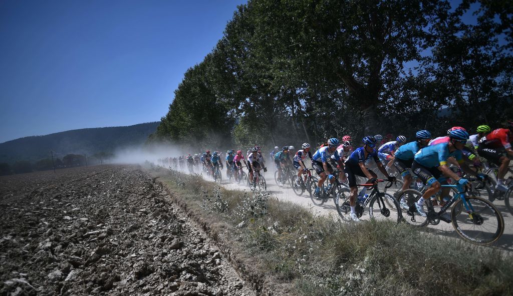 The pack rides through the countryside during the oneday classic cycling race Strade Bianche White Roads on August 1 2020 around Siena Tuscany Photo by Marco Bertorello AFP Photo by MARCO BERTORELLOAFP via Getty Images