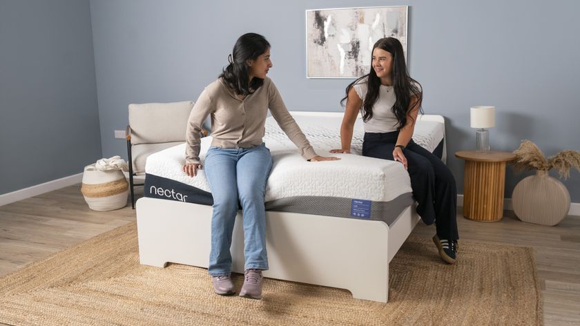 Two testers for Tom&#039;s Guide sat on the Nectar Luxe mattress and smiling at each other