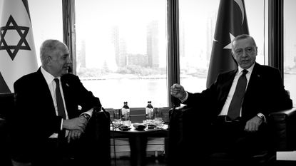 Israeli Prime Minister Benjamin Netanyahu seated next to Turkish President Recep Tayyip Erdogan in 2023