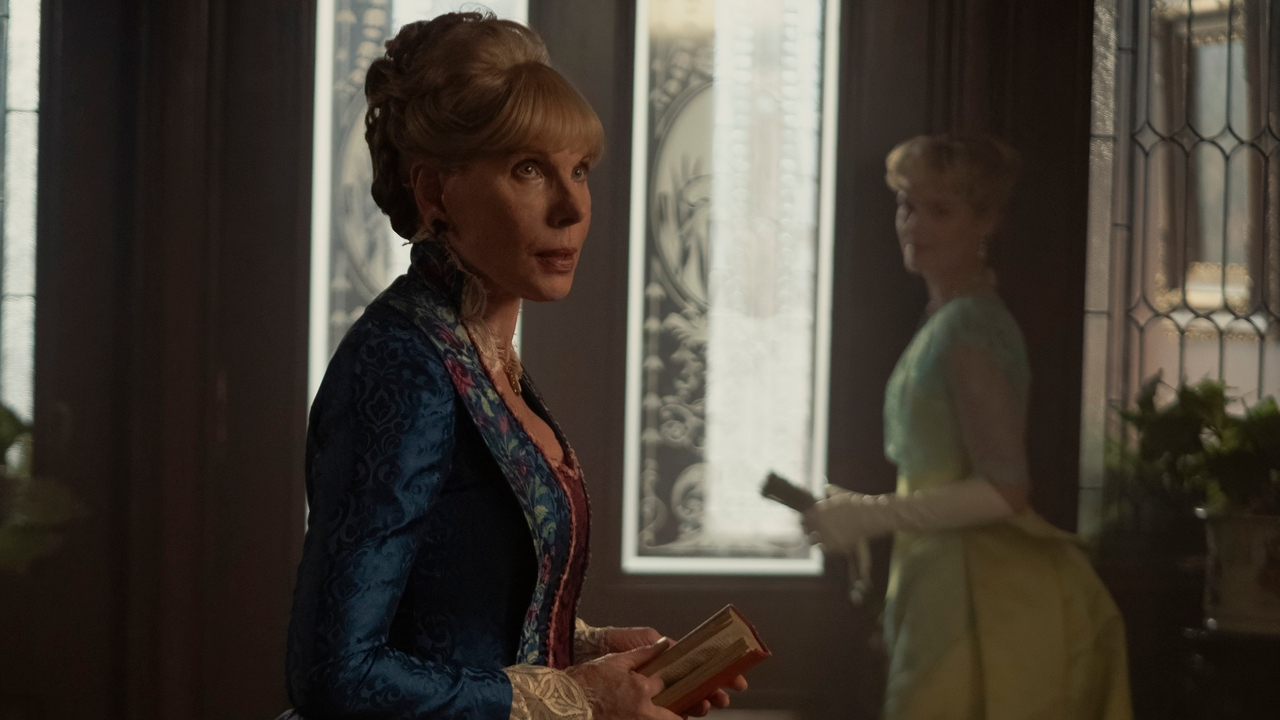 Christine Baranski looks forward with upset while Louisa Jacobson watches in The Gilded Age S3 E2 - "What the Papers Say."