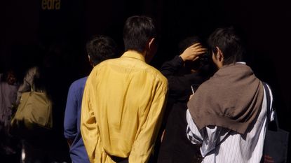 Visitors queue for Edra's show at Palazzo Durini during Milan Design Week