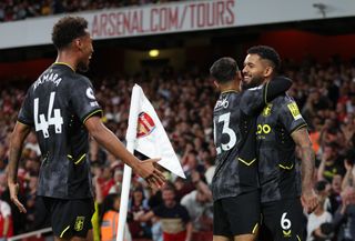 Douglas Luiz celebrates with Aston Villa team-mates after scoring directly from a corner against Arsenal in August 2022.