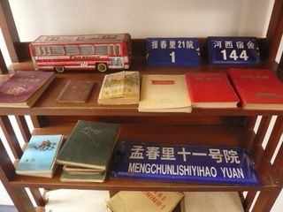 Vintage notebooks on a wooden shelving unit