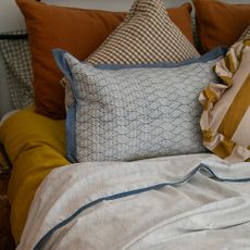 An Indian Dohar blanket on a bed